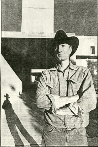Bruce Nauman stands in front of his sculpture, which had recently been vandalized. Photo taken for the Albuquerque Journal, Vol 11 No 19, Facility Planning #028